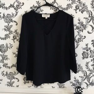Black blouse with cross cross V neck